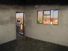 Looking into Shale's house through the back window