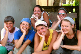 Six smiling team members posing