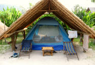 Tent under thatched roof